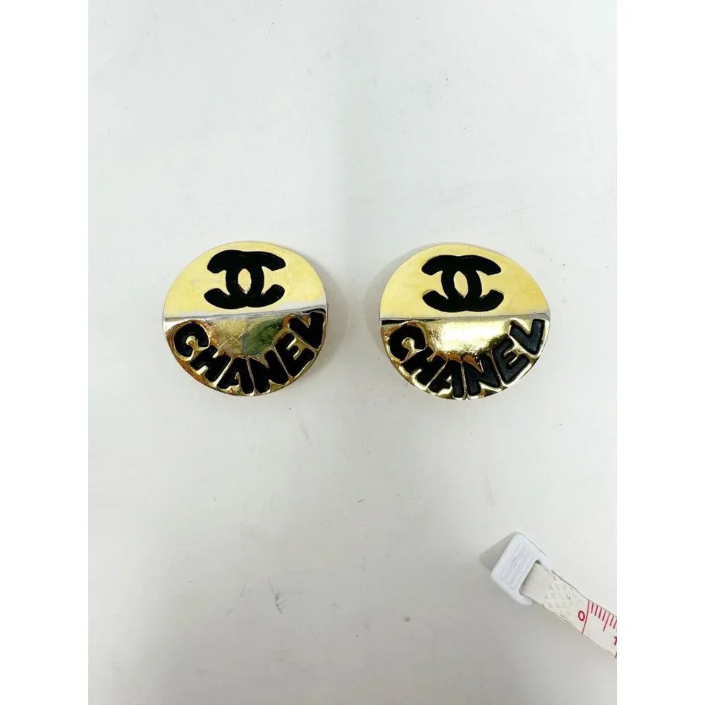 Chanel Pair of Gold Plated Black Metal Clip On Earrings Interlocked C Logo Round